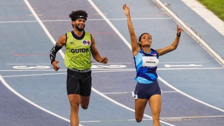 Simran and her guide Umar Saifi celebrates upon winning gold the women's 100m T12 event during the World Para Athletics Championships 2025 (PTI Photo)